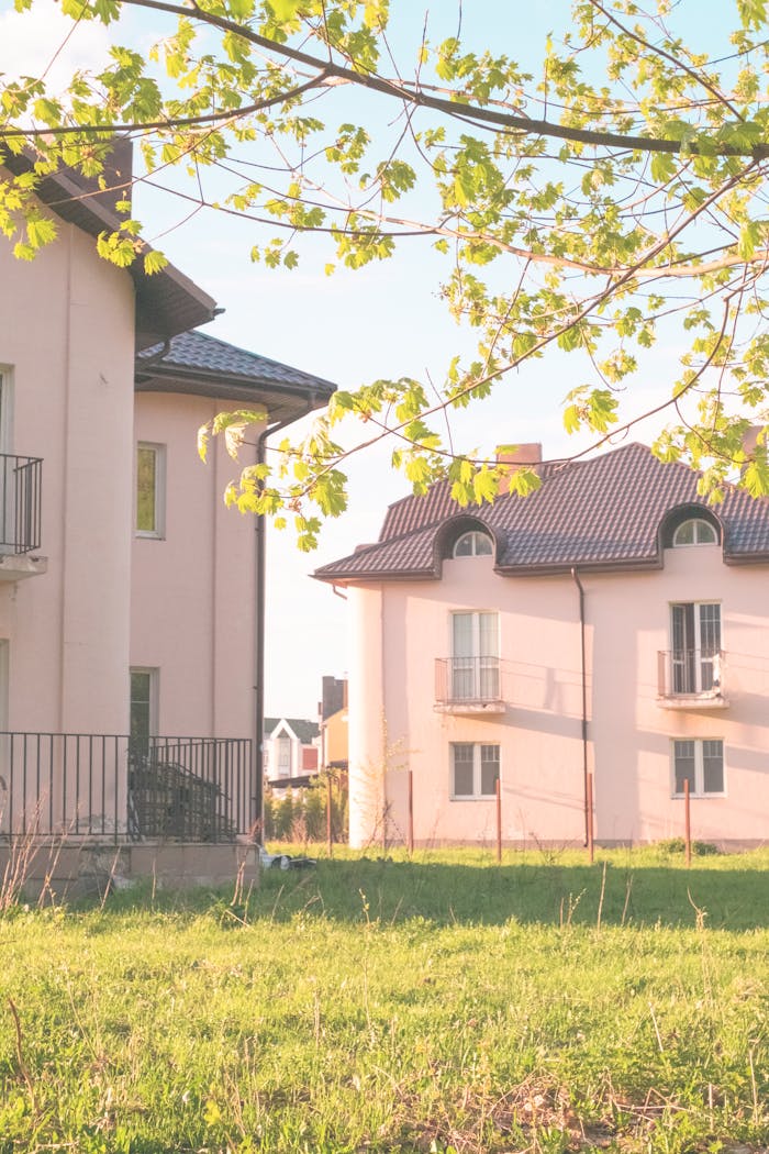 Charming residential area with modern houses under vibrant spring foliage.